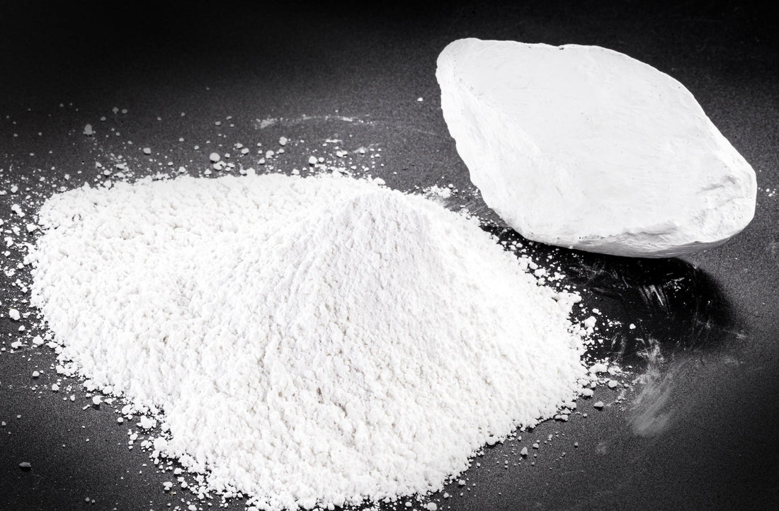 Image of Kaolin white powder on black counter