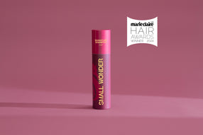 Small Wonder Signature Shampoo Refill Tube next to Marie Claire Hair Awards label